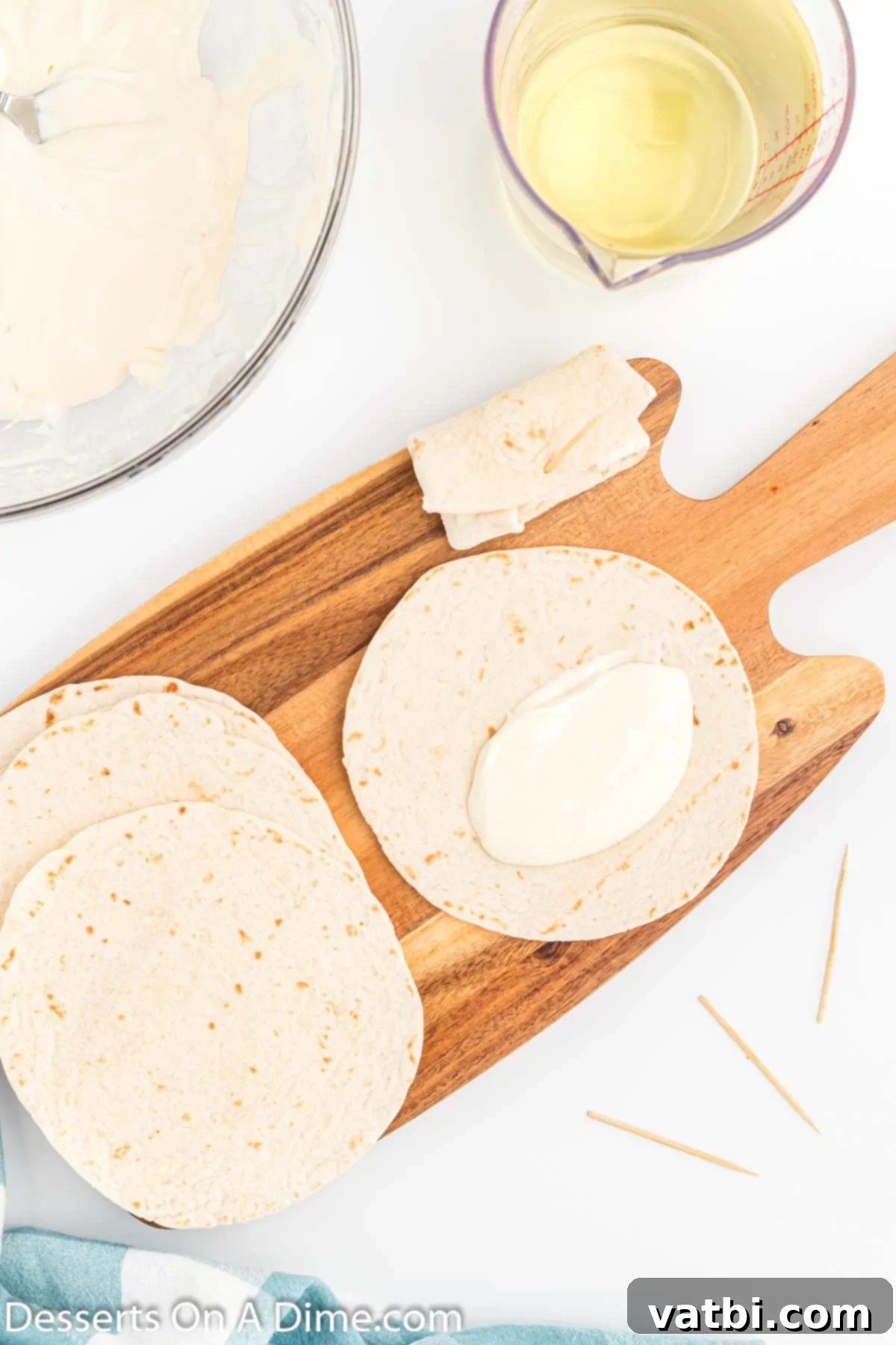 Crispy Cheesecake Dessert Chimis 6 Mixture adding to each tortilla.