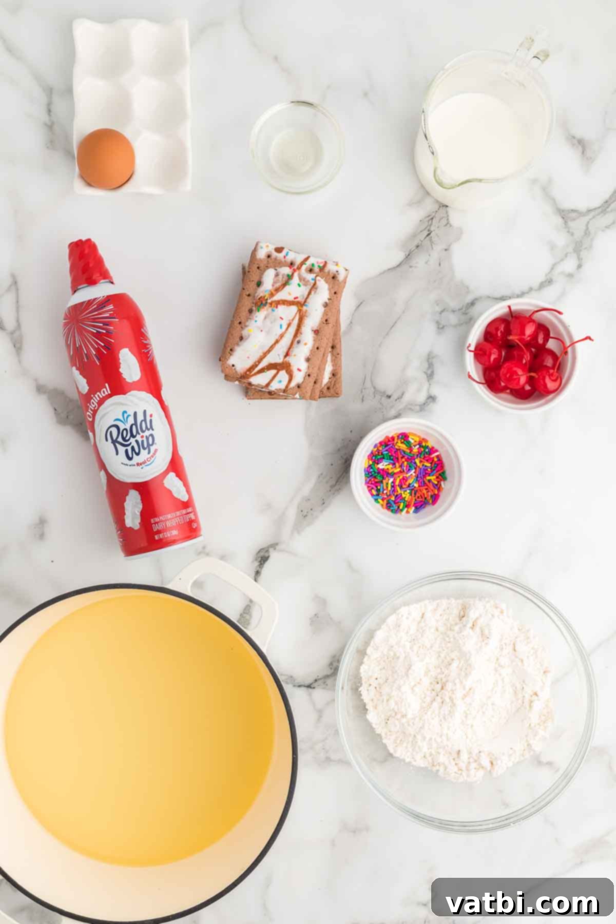 Golden Crisp Pop Tart Heaven 3 Ingredients for Deep fried pop tarts including pop tarts, cooking oil, sprinkles, maraschino cherries, pancake mix, whipped cream, milk, and an egg.