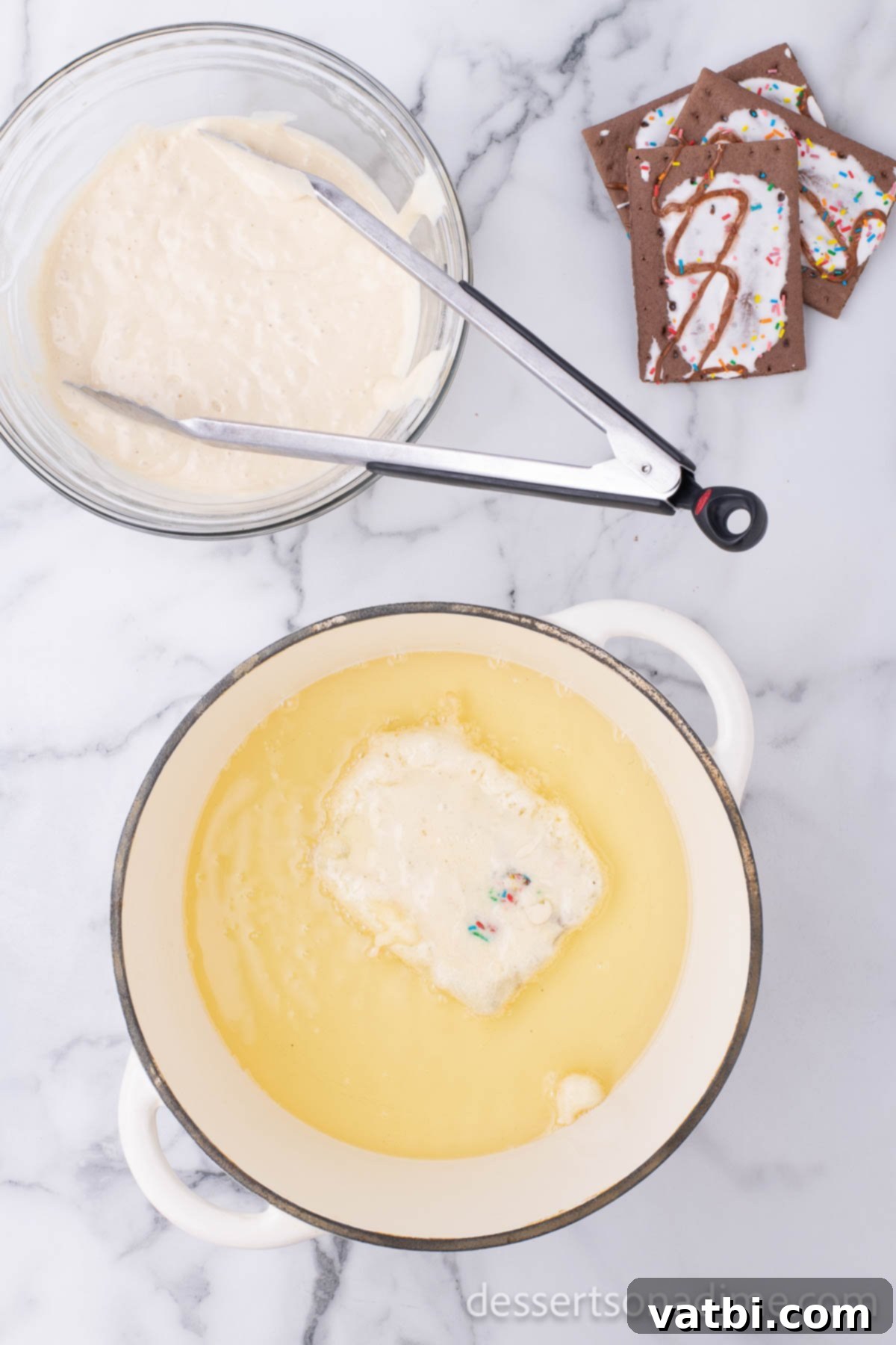 Pop Tarts Get a Delicious Deep Fried Makeover 8 A Pop Tart frying in hot oil, bubbling and turning golden.