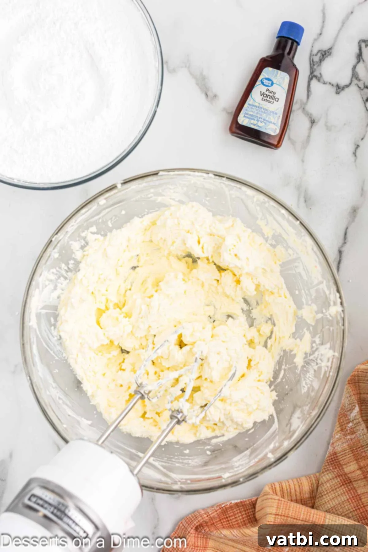 Easy Homemade Cream Cheese Frosting 4 Mixing bowl with butter and cream cheese.