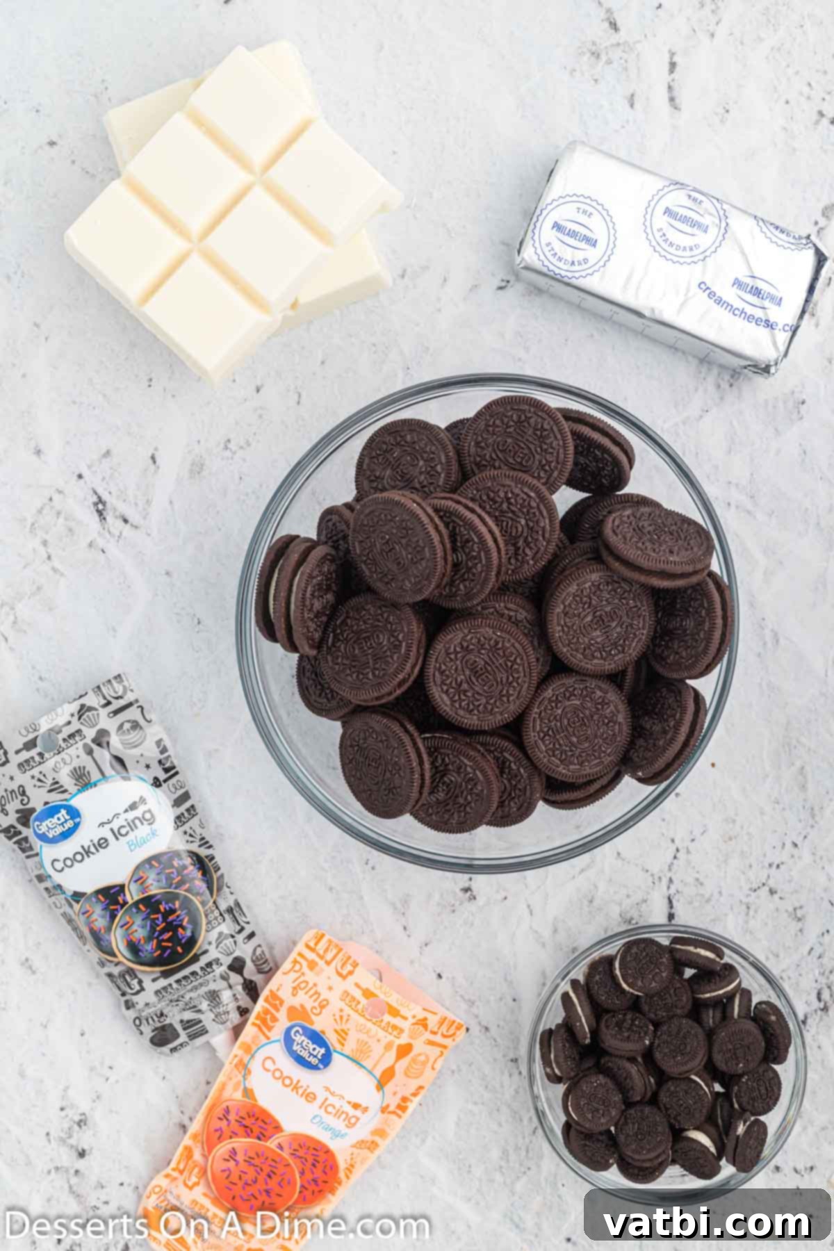 Whimsical Winter Oreo Bites 3 Ingredients for Snowman oreo balls including softened cream cheese, Oreo cookies, vanilla almond bark, mini Oreo cookies, orange and black decorating icing.