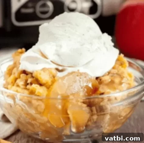 Effortless Dump Cake Delights 4 Crockpot Apple Dump Cake in a slow cooker, showing tender apples under a golden cake topping.