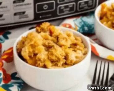 Effortless Dump Cake Delights 5 Crock Pot Peach Dump Cake, rich with juicy peaches and a tender cake topping, cooked to perfection in a slow cooker.