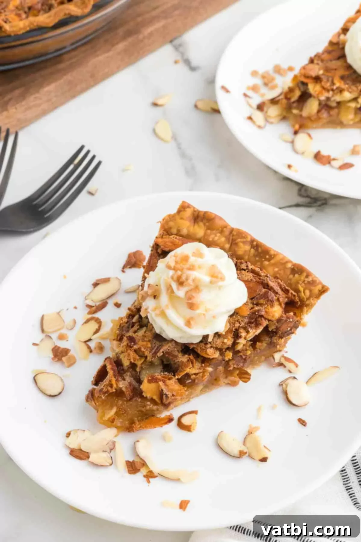 Rich Toffee Almond Indulgence 2 Slice of Toffee almond Pie topped with whipped cream.