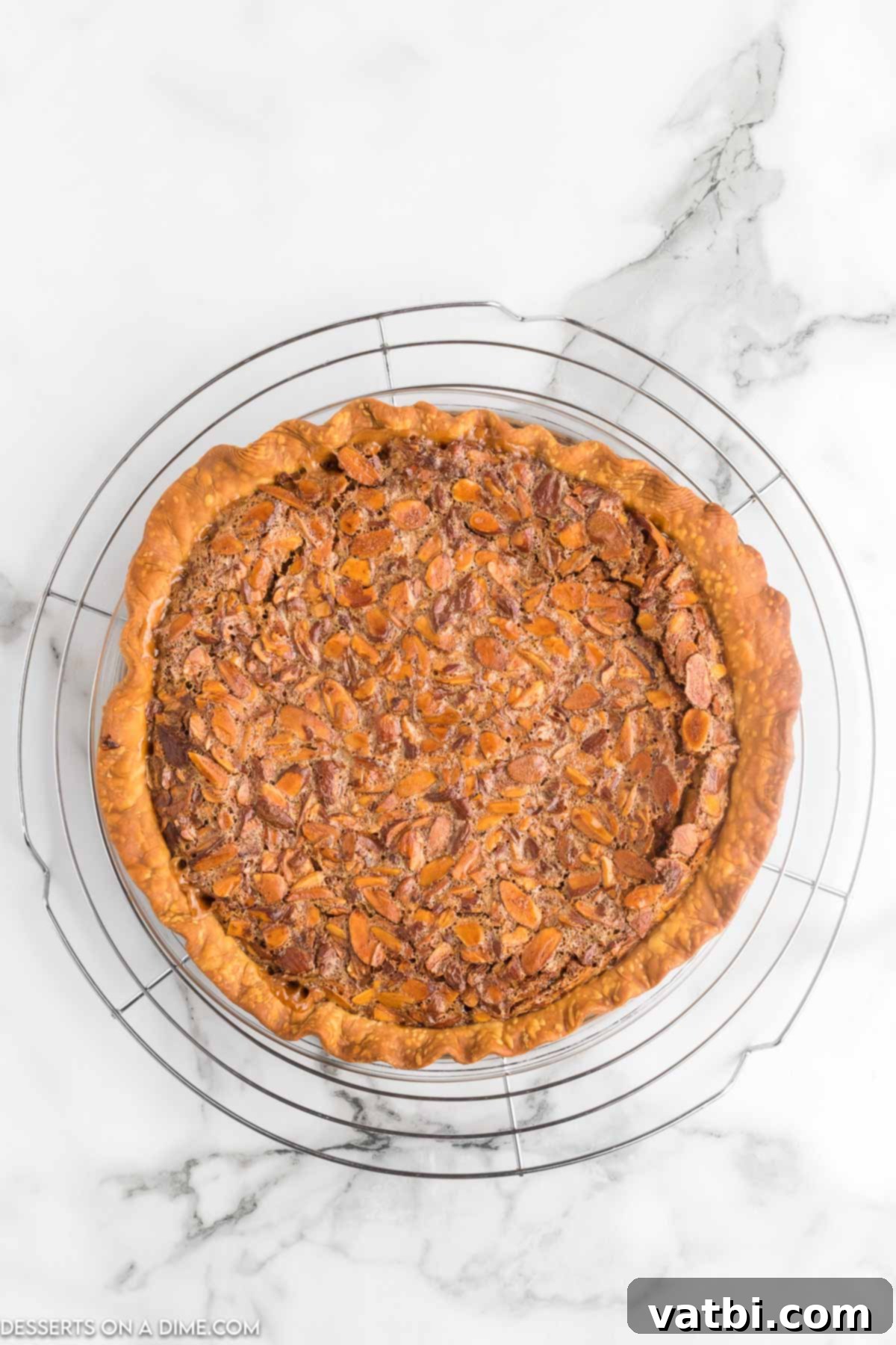 Rich Toffee Almond Indulgence 9 Toffee Almond Pie baked and cooling on wire rack.