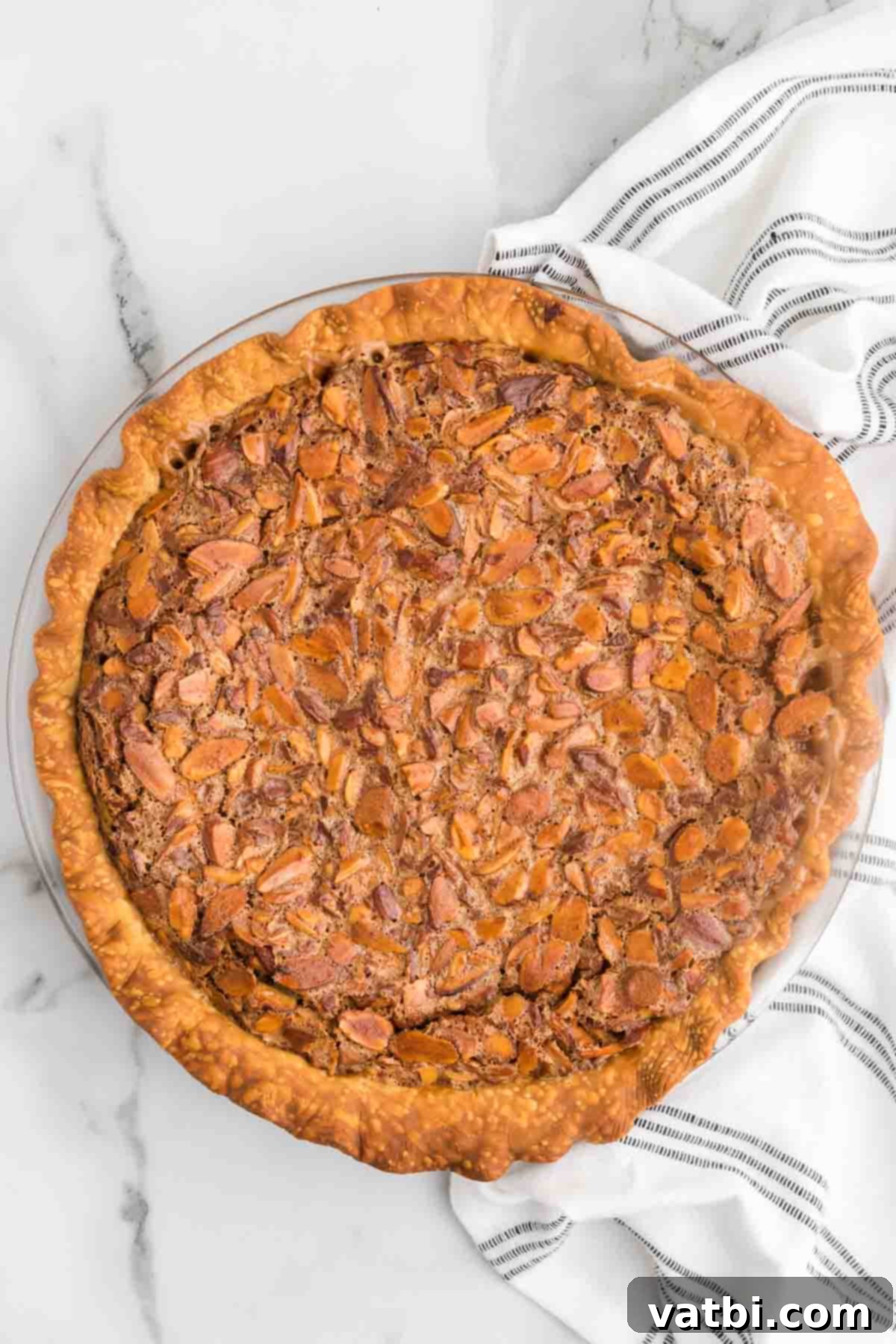 Rich Toffee Almond Indulgence 10 Toffee almond Pie ready to cut into slices.