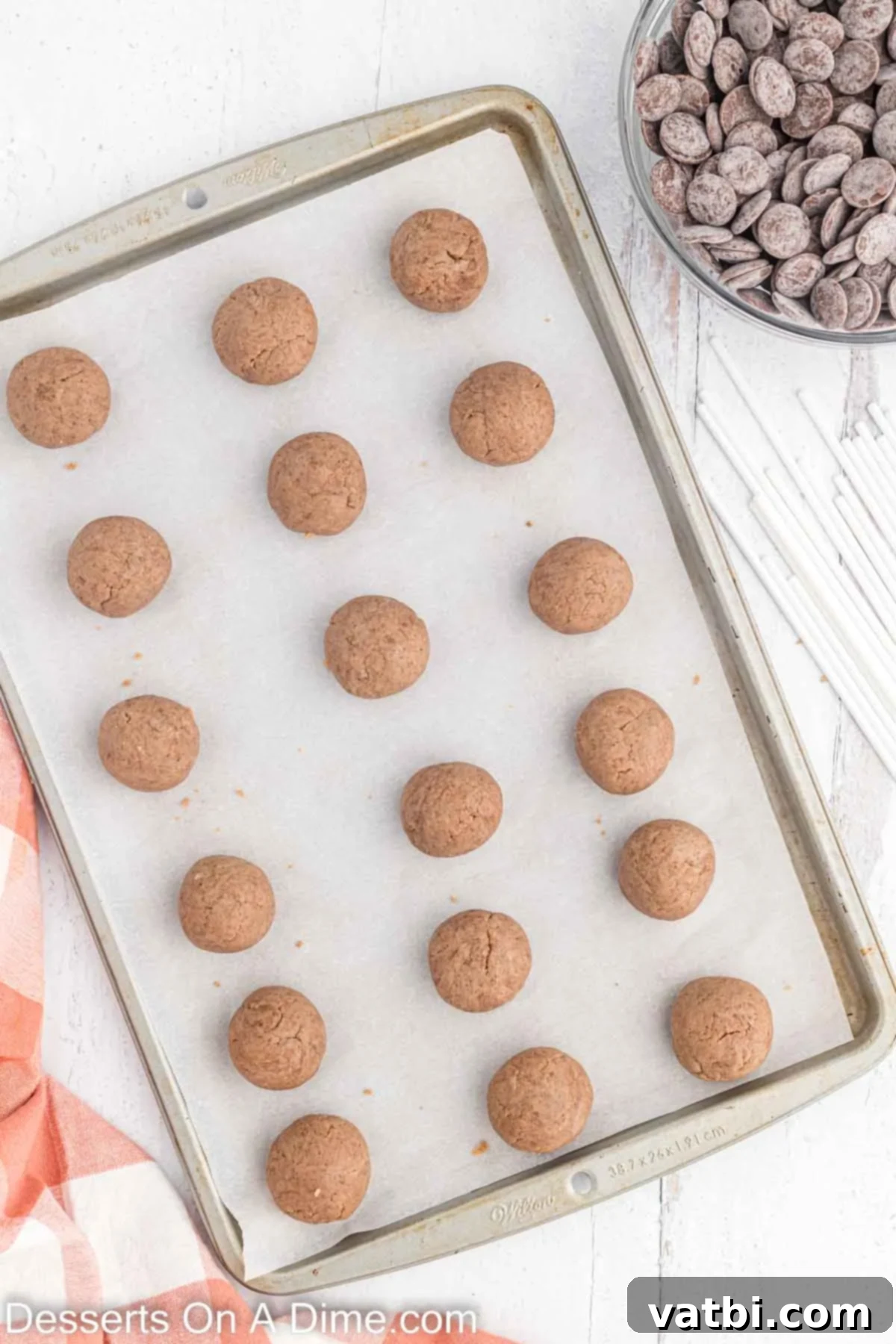 Gobble-Worthy Thanksgiving Cake Pops 6 Cookie dough scooped into balls and placed on a baking sheet.