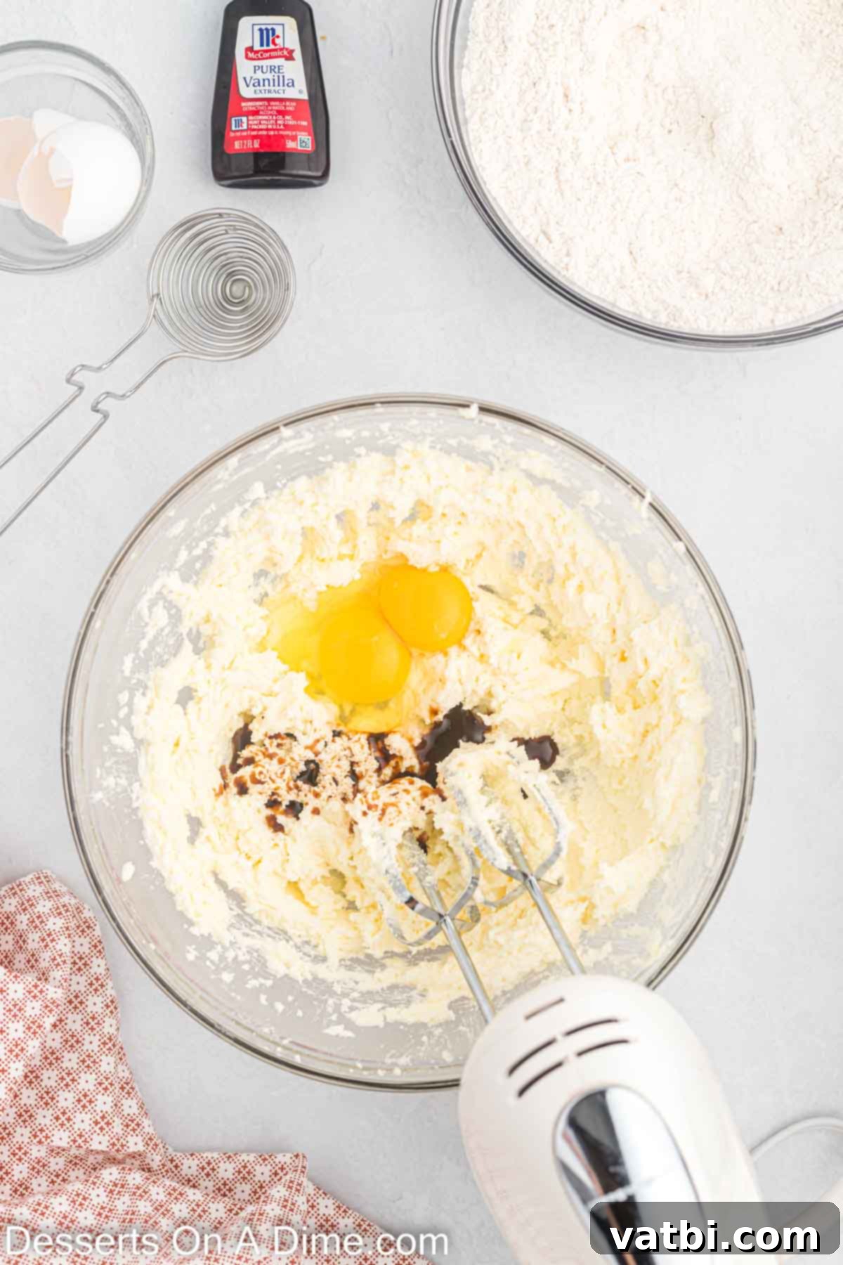 Mixing bowl with butter, sugar and eggs.