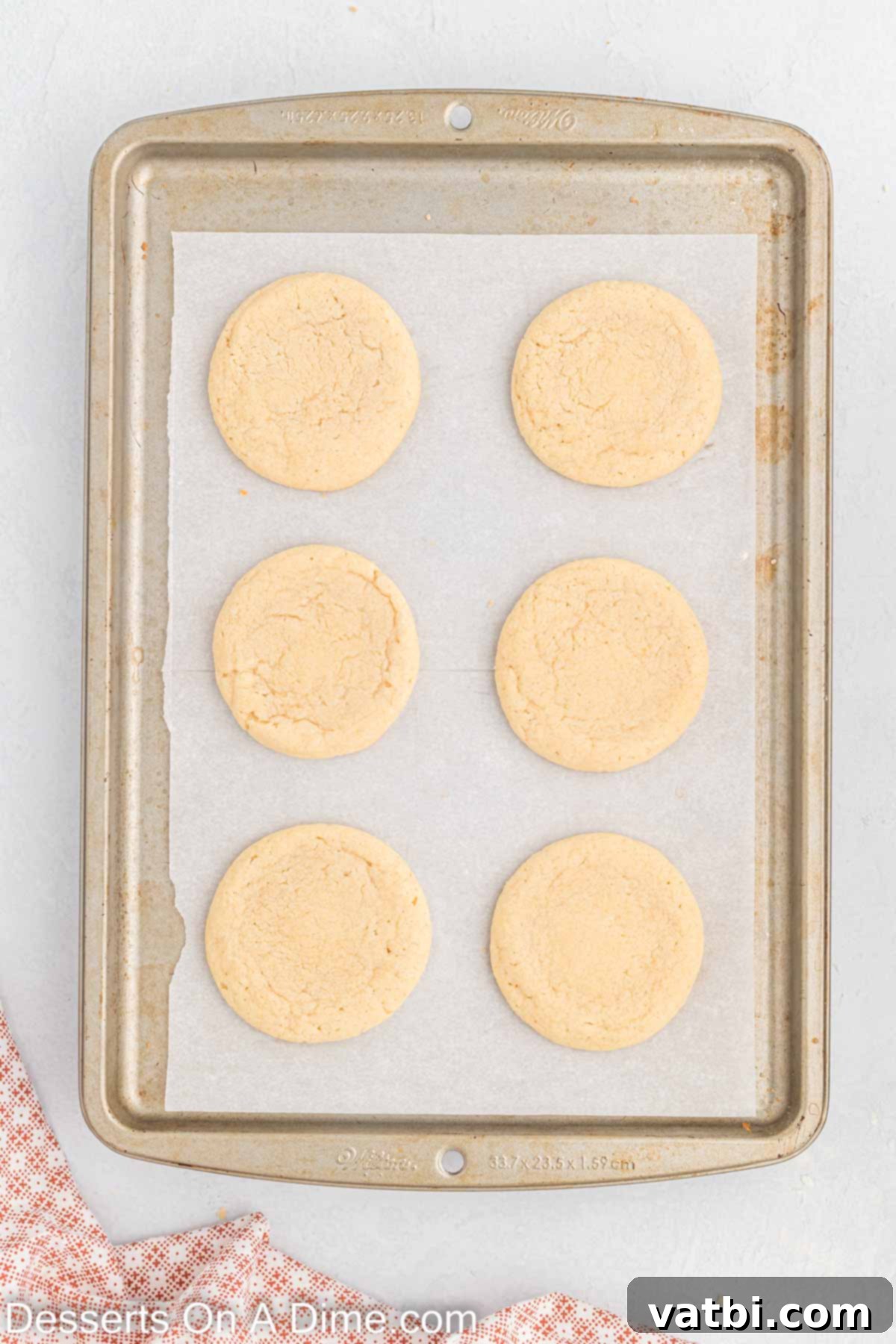 Cookies on baking sheet cooling.