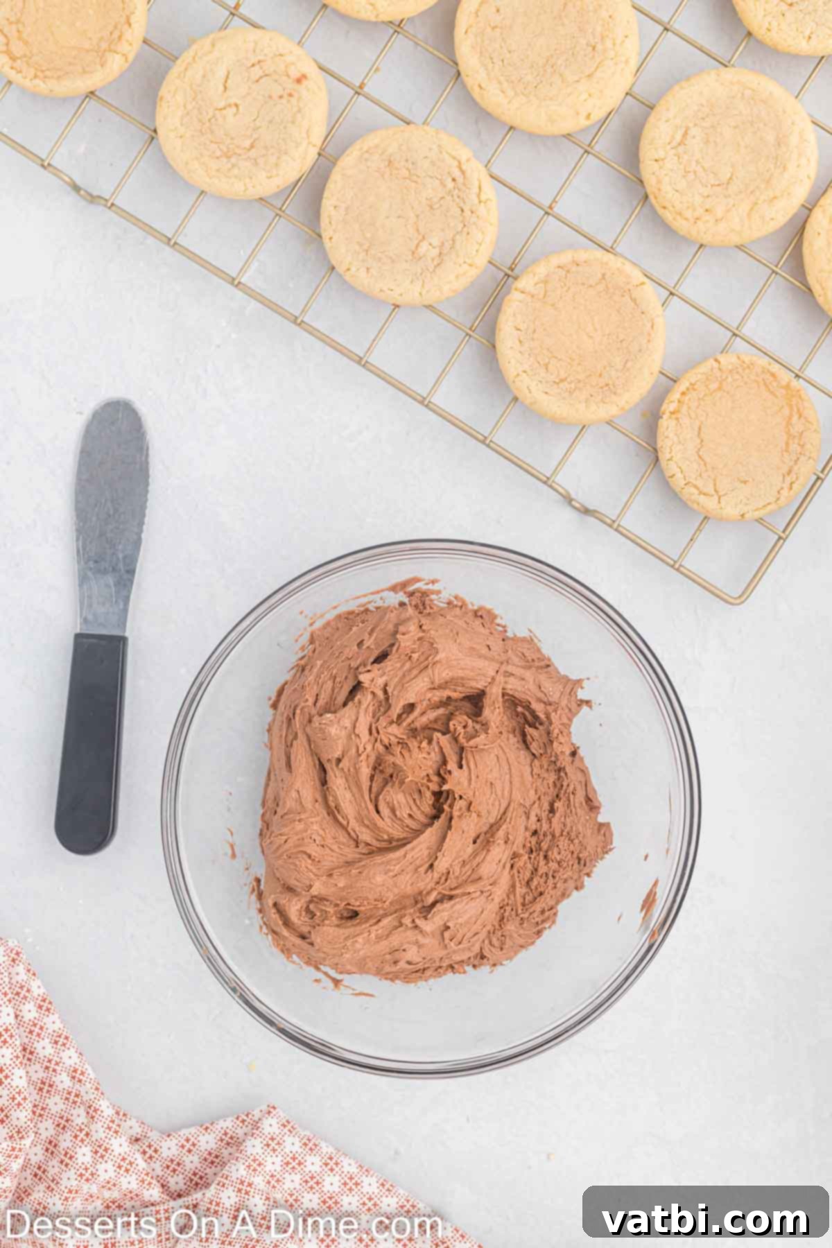 Milk and vanilla extract mixed into frosting ingredients.