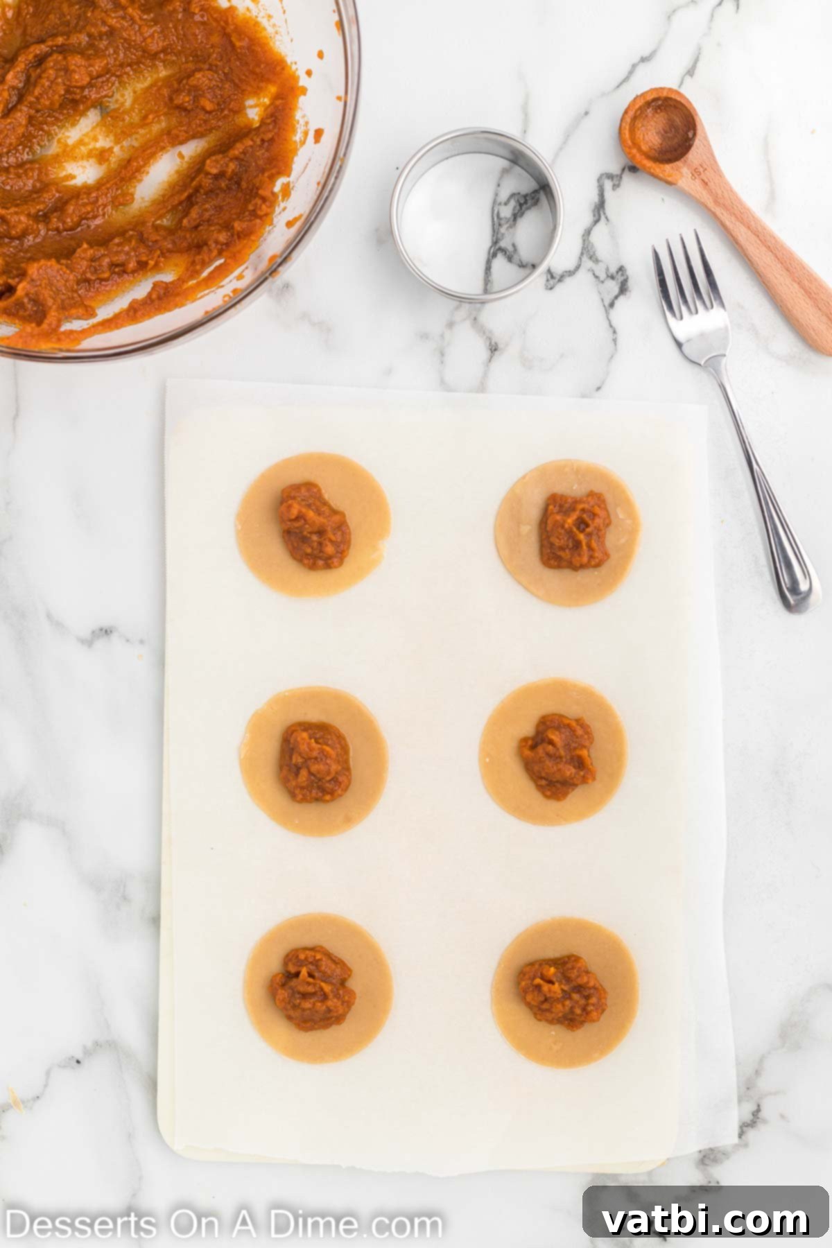 Pumpkin Pie Cookies 6 Pie mixture on dough circles.