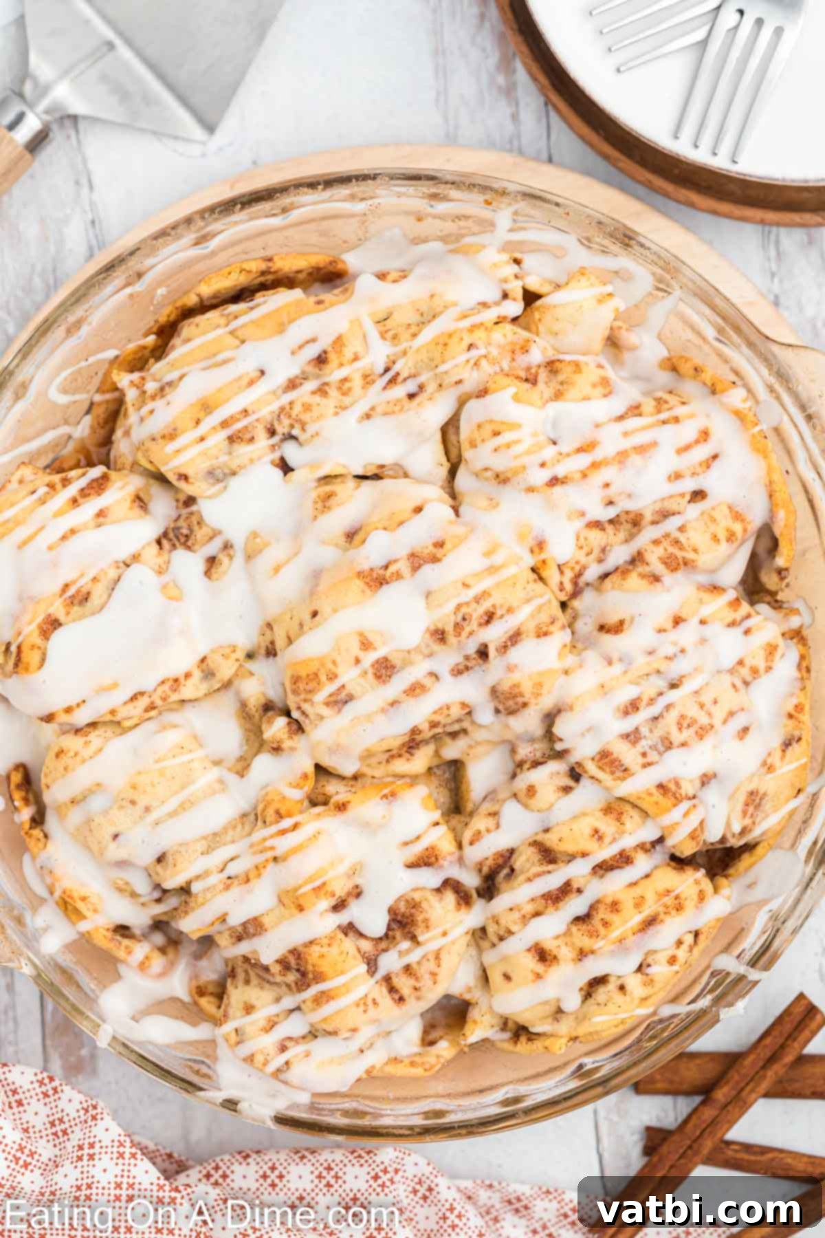 Delicious Cinnamon Roll Apple Pie 2 A golden brown cinnamon roll apple pie, fresh from the oven, in a baking dish.