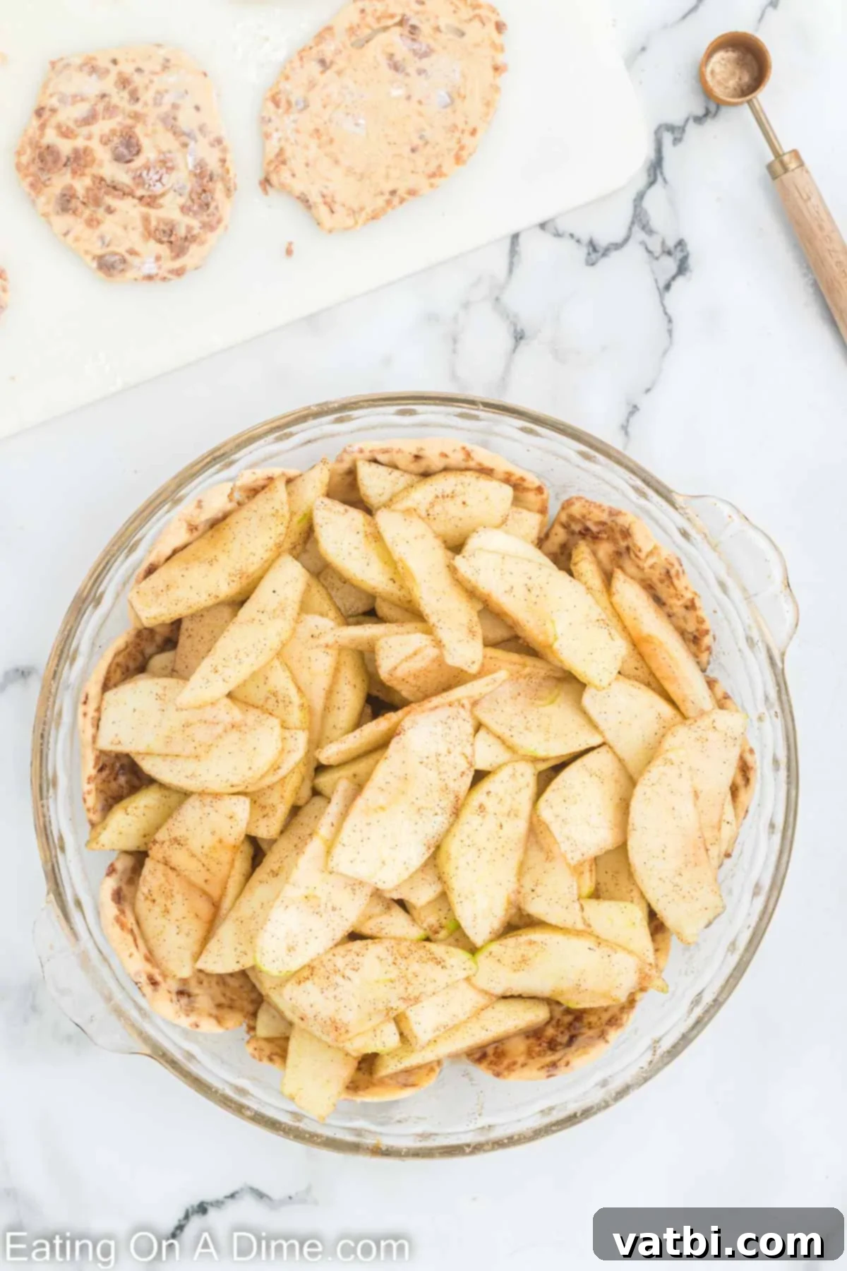 Delicious Cinnamon Roll Apple Pie 6 Thinly sliced apples mixed with spices, layered on top of the cinnamon roll crust.
