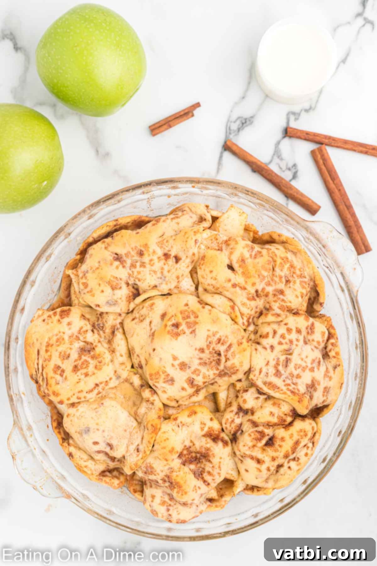 Delicious Cinnamon Roll Apple Pie 7 Remaining cinnamon rolls layered decoratively on top of the apple filling.