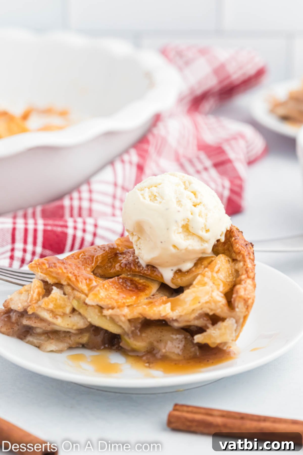 Indulgent Salted Caramel Apple Pie 2 Slice of Salted Caramel Apple Pie on a plate.