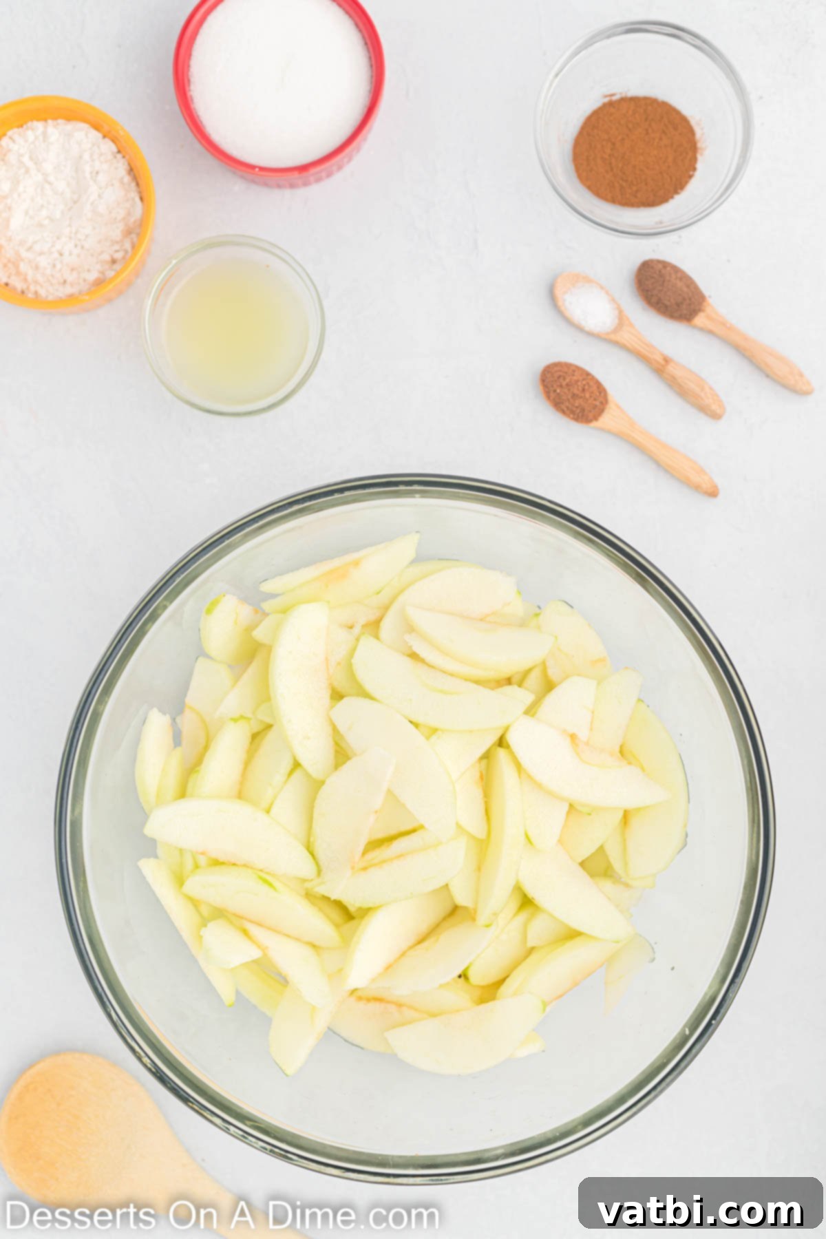 Indulgent Salted Caramel Apple Pie 4 Apple slices in a bowl.