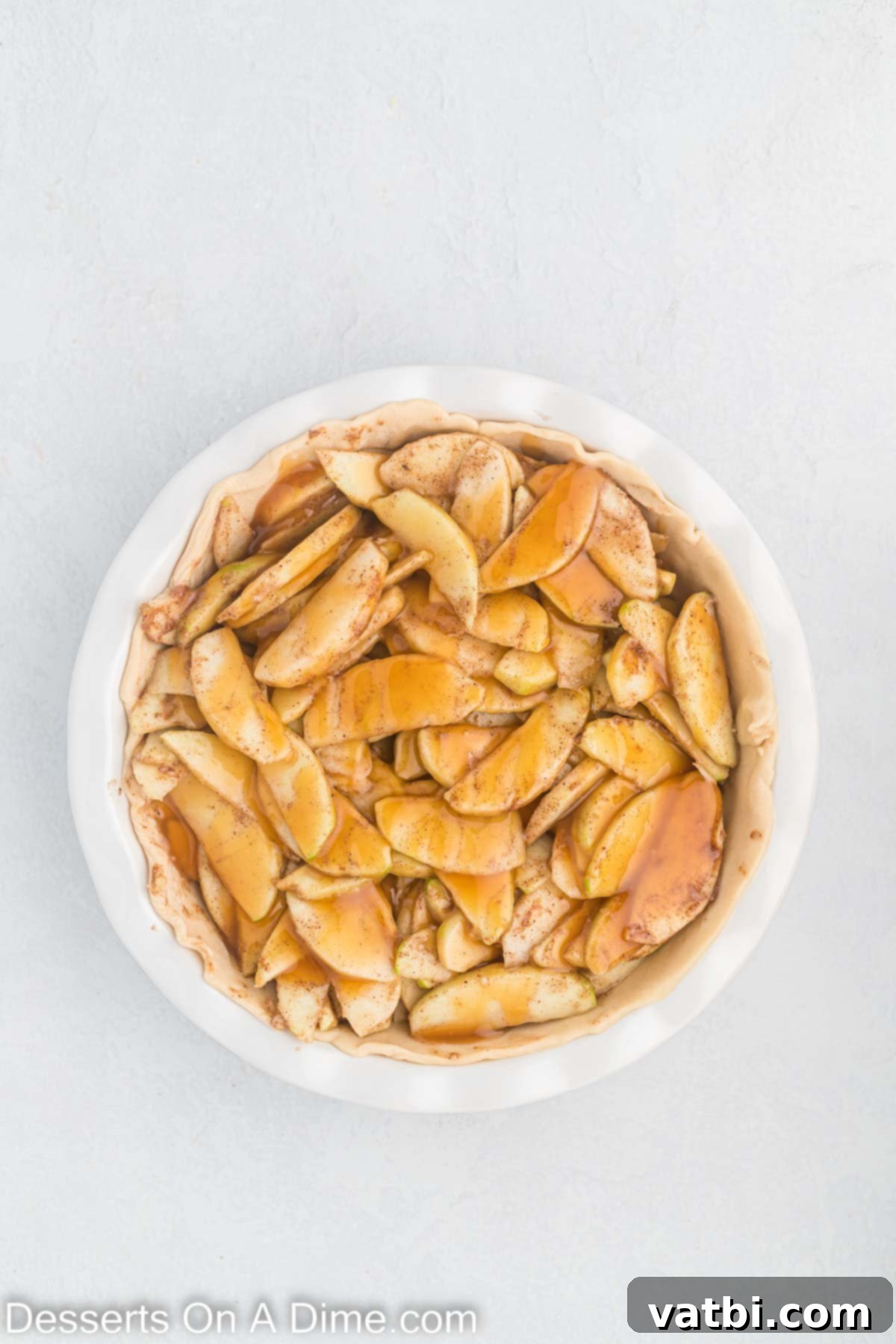Indulgent Salted Caramel Apple Pie 7 Apple slices in pie crust.