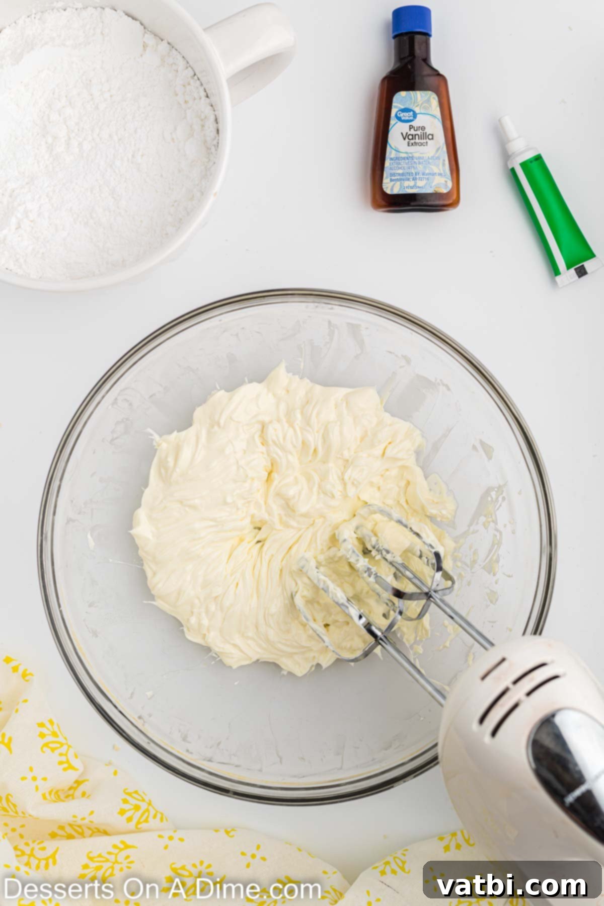 Festive Christmas Tree Sugar Cookies 8 A large mixing bowl containing softened cream cheese and butter, thoroughly beaten together until the mixture achieves a perfectly smooth and creamy consistency, ideal for frosting.