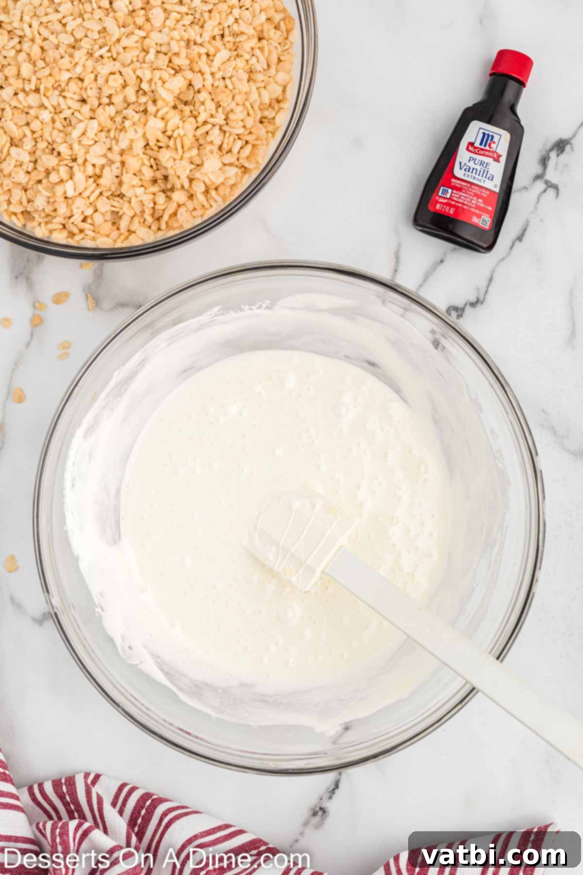 Bowl showing melted butter and mini marshmallows, perfectly combined and ready for the cereal.