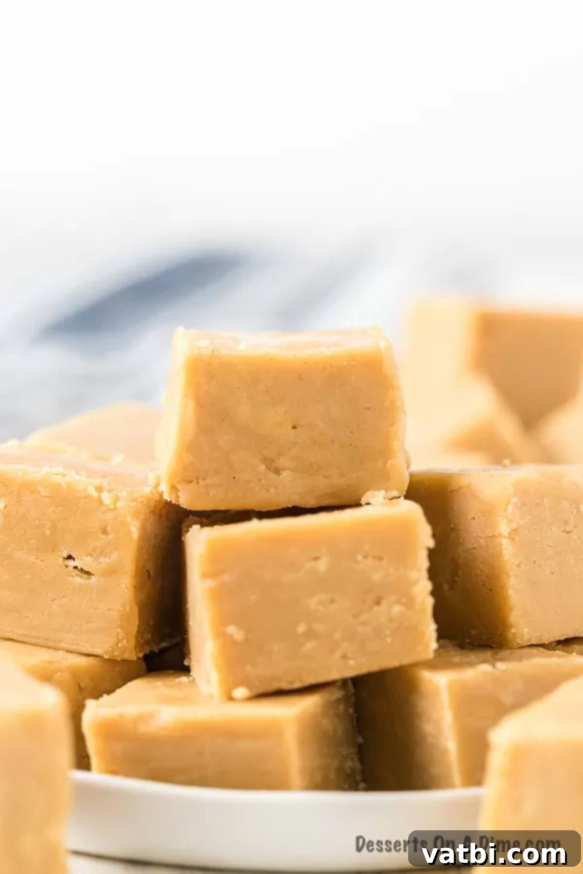 The Ultimate Fudge Freezing Guide 3 Caramel fudge stacked on a white plate