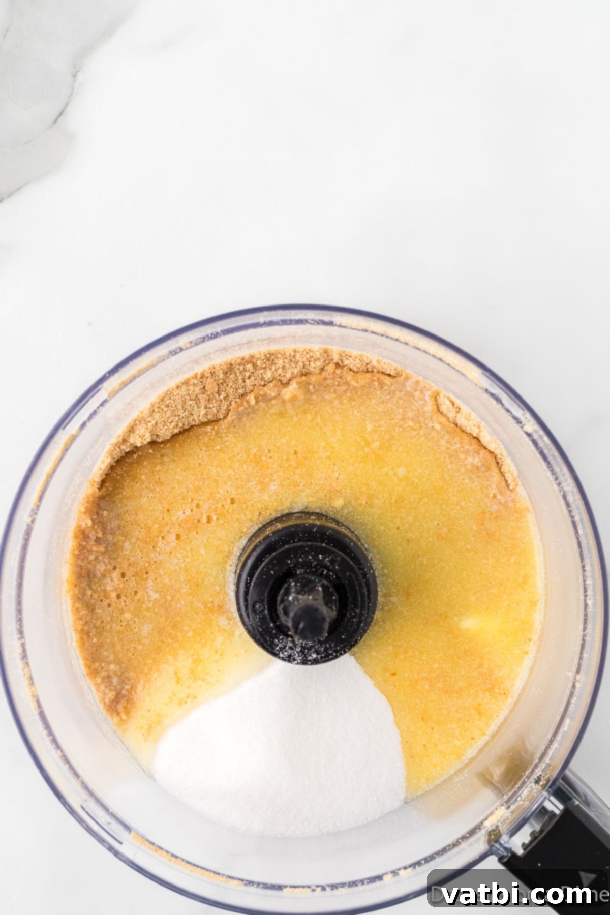 Tangy Lemon Delight 5 Sugar and salt added to crumbs in food processor.