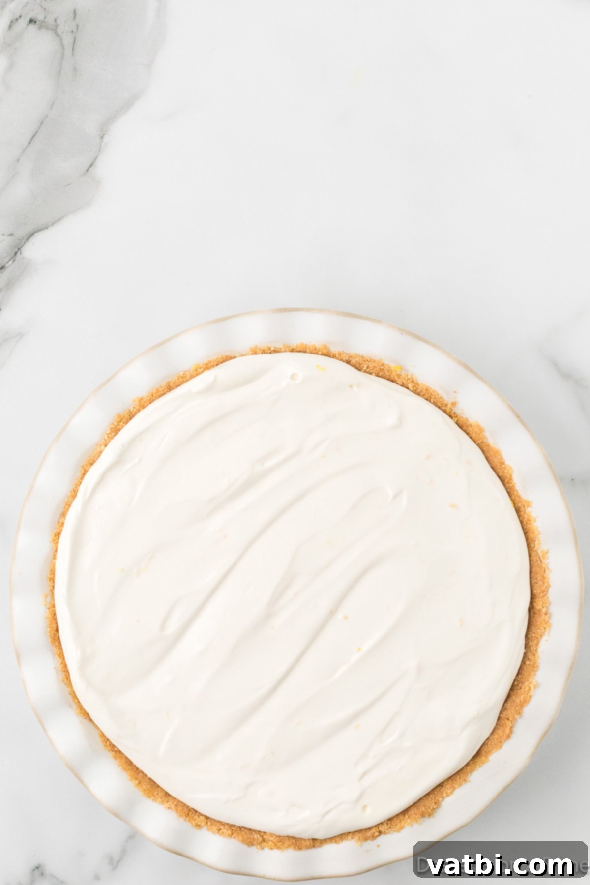 Tangy Lemon Delight 9 Filling poured into pie.