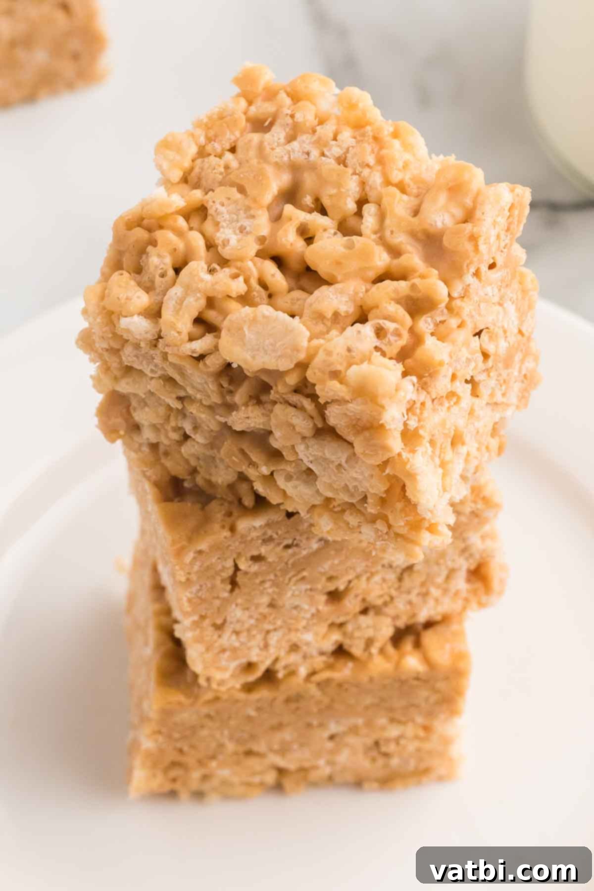 Speculoos Krispie Delights 2 Cookie butter rice krispie treats stacked together.