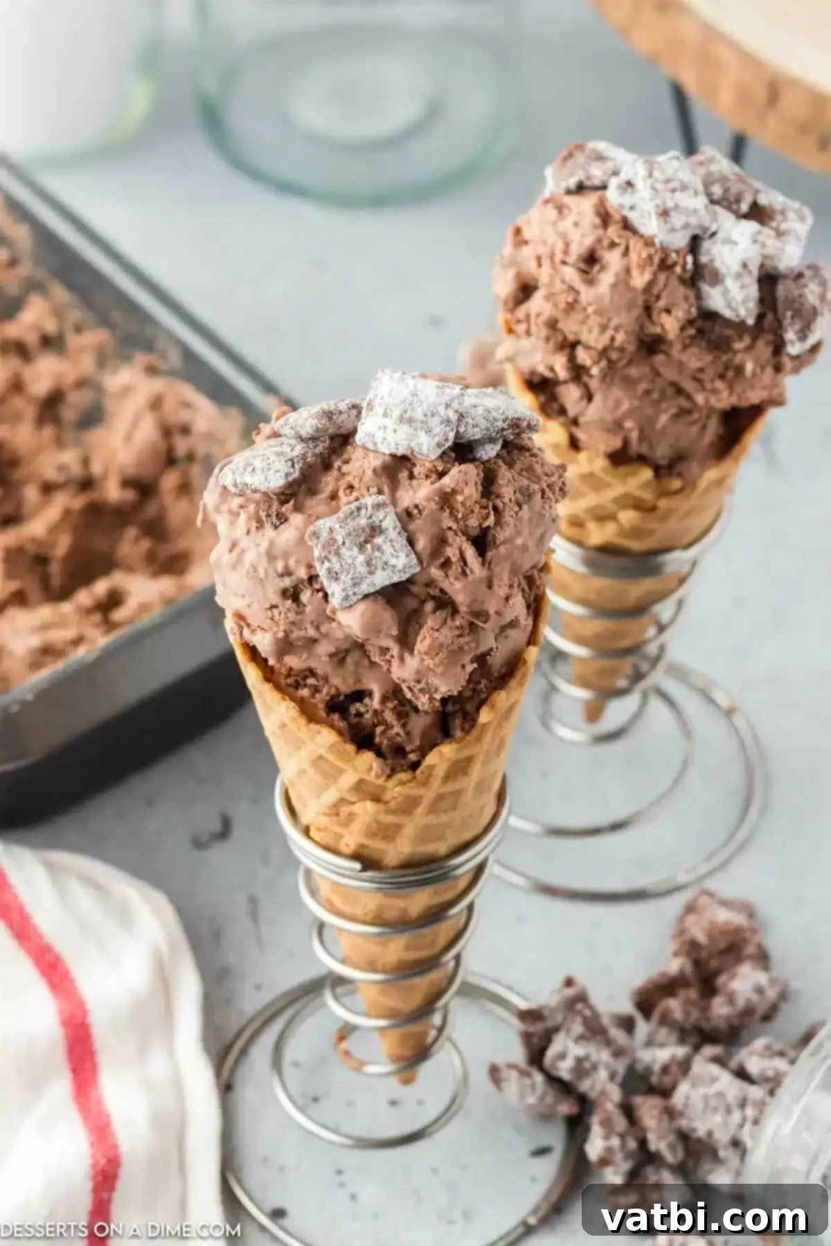 Decadent Puppy Chow Ice Cream 2 Puppy chow ice cream in cones.