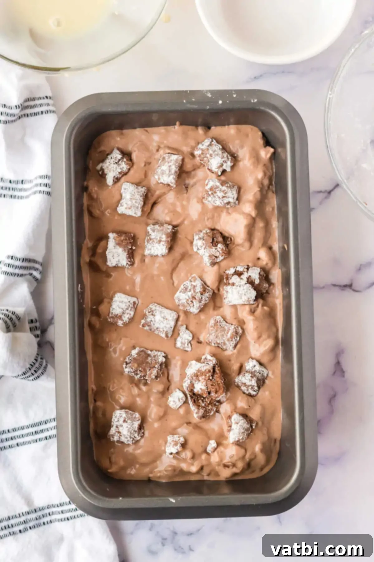 Decadent Puppy Chow Ice Cream 6 Ice cream mixture in loaf pan.