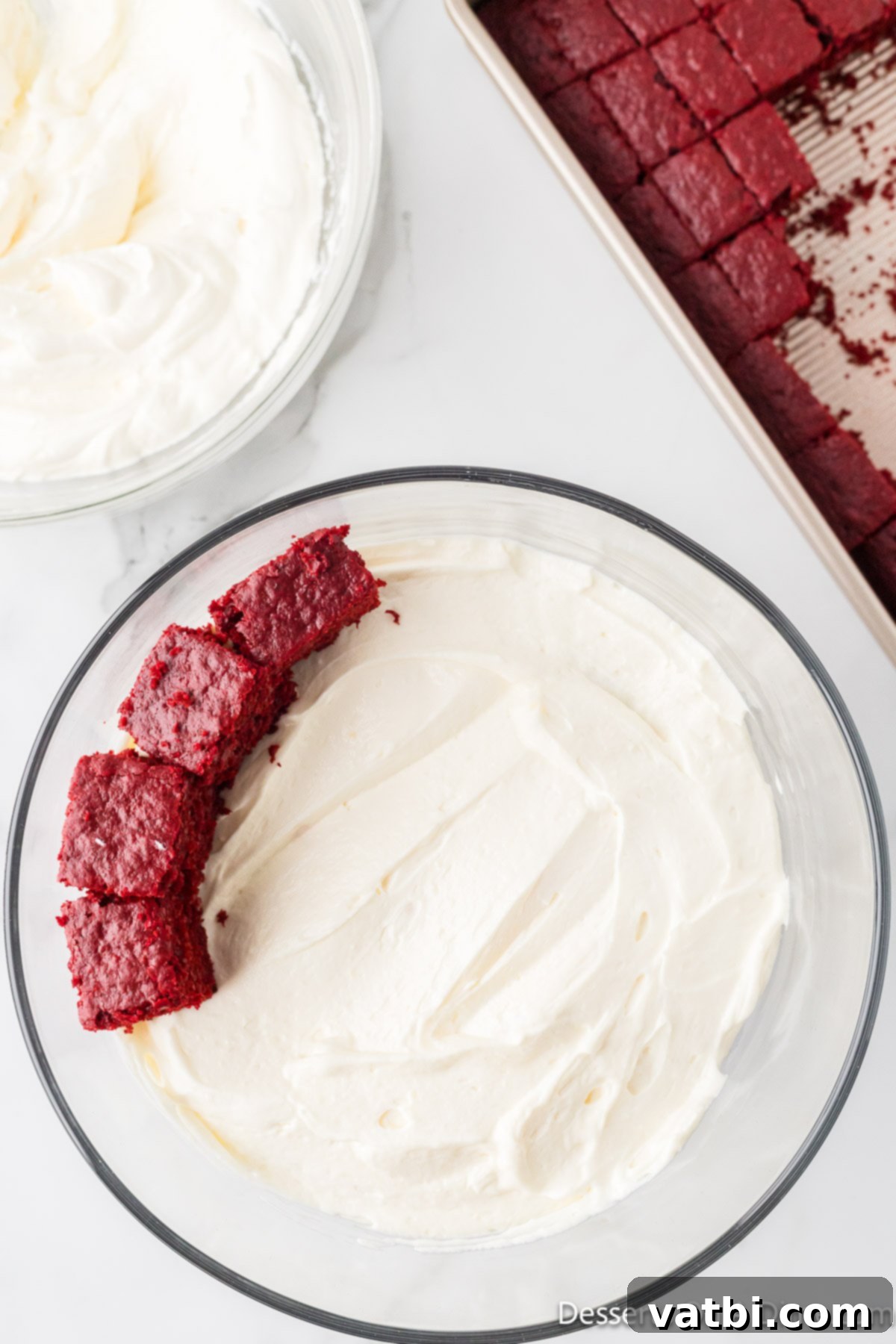 Crimson Velvet Trifle 14 Second layer of red velvet cake cubes spread over the cream cheese layer.