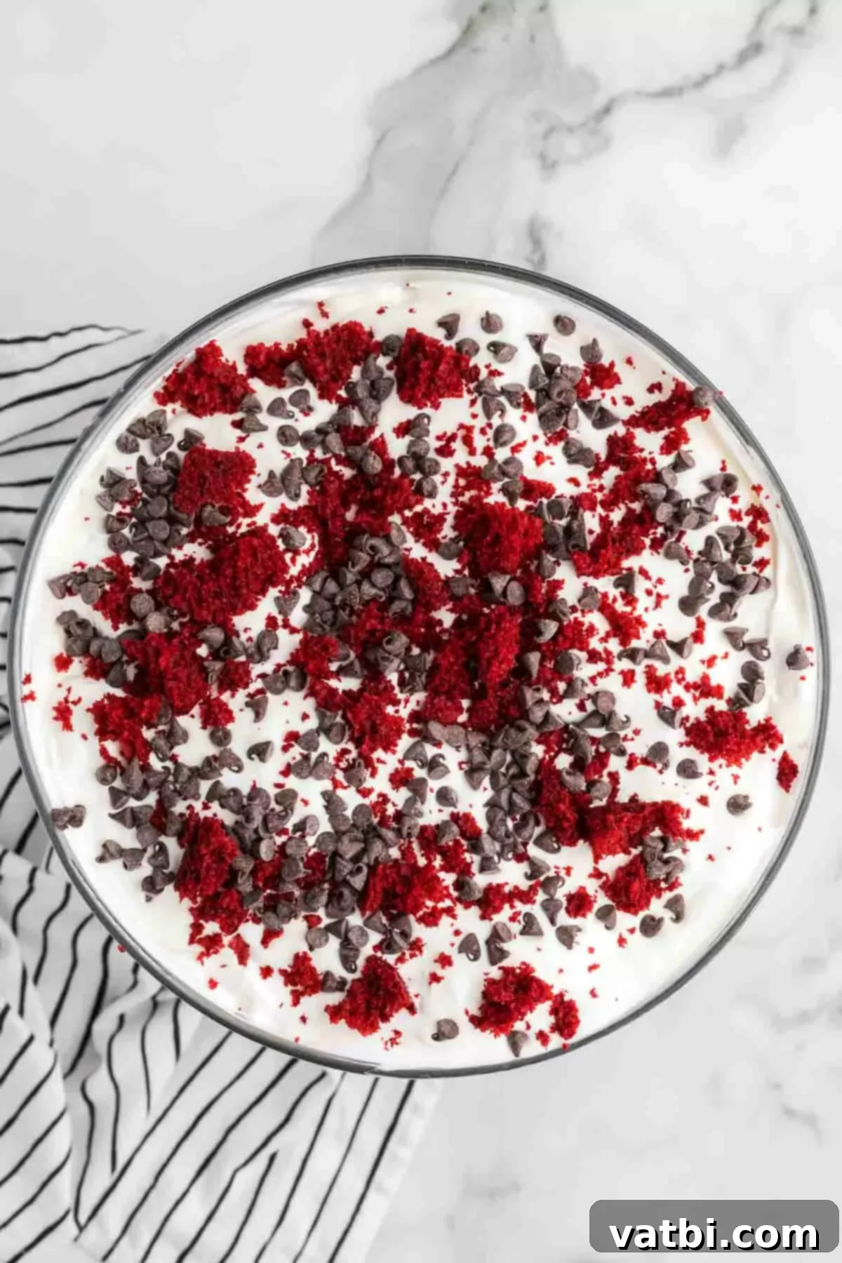 Crimson Velvet Trifle 17 Trifle garnished with reserved cake crumbs and mini chocolate chips.