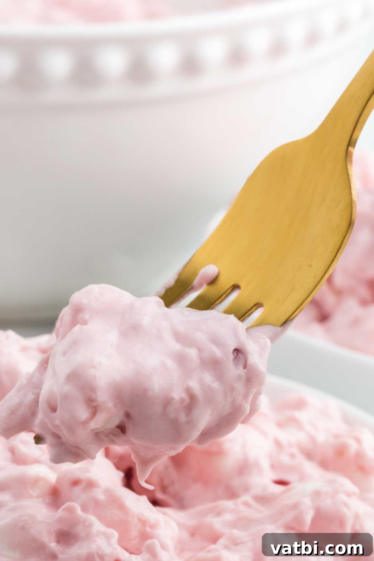 Ruby Cloud 10 Cherry fluff recipe in a bowl with a fork.