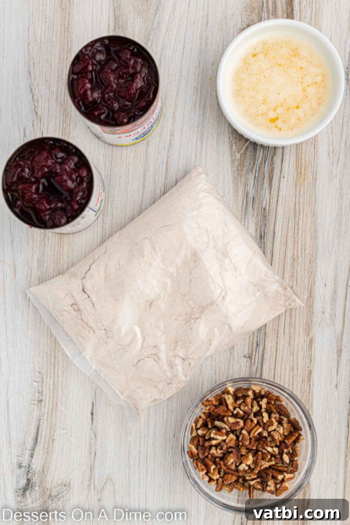 Holiday Dump Cake Delight 3 Ingredients for Christmas dump cake- cake mix, cranberries, nuts, butter.