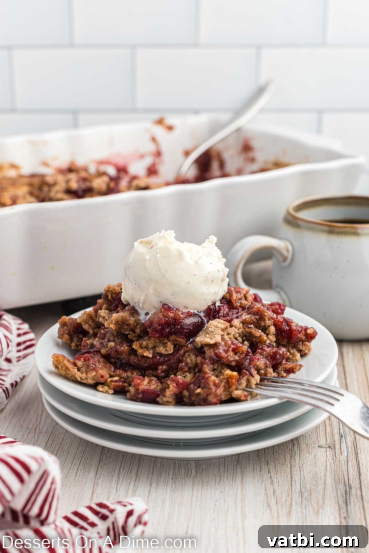 Holiday Dump Cake Delight 9 Serving of cake on a plate and topped with ice cream.