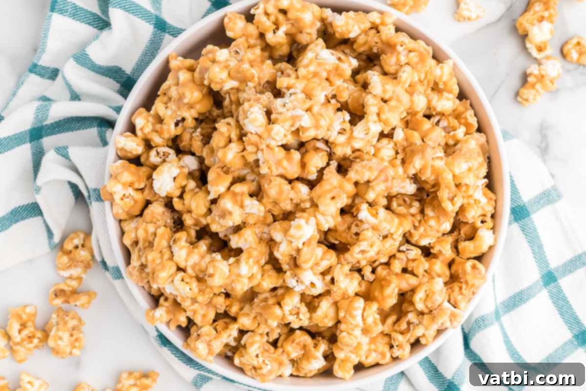 Bowl of freshly made Peanut Butter Popcorn, perfectly coated and ready to enjoy.