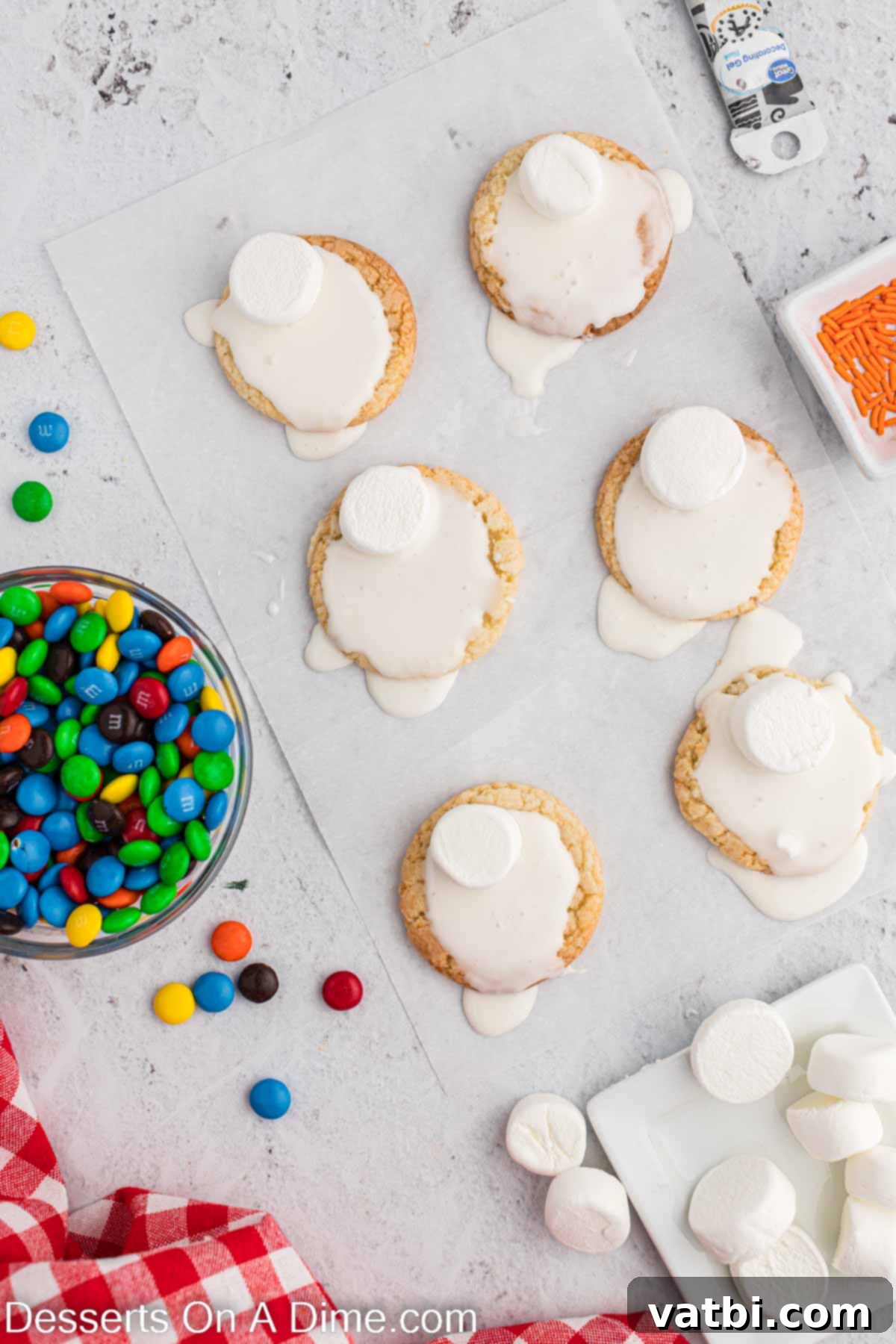 Adorable Melted Snowman Cookies 5 Icing spread on cookies.