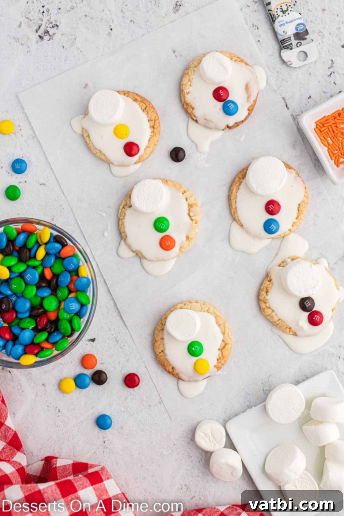Adorable Melted Snowman Cookies 6 M&M's placed on each cookie.
