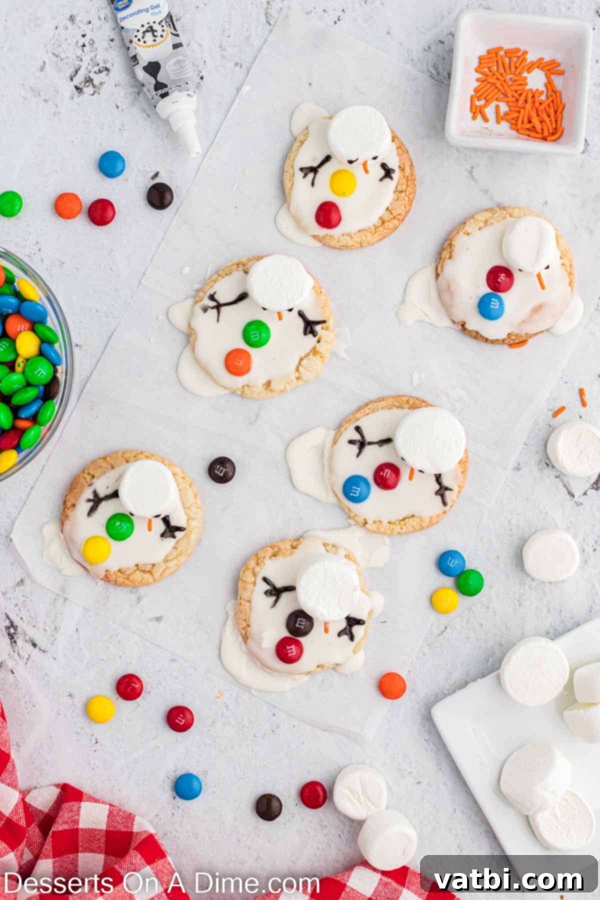 Adorable Melted Snowman Cookies 7 Black icing used to decorate and add arms.