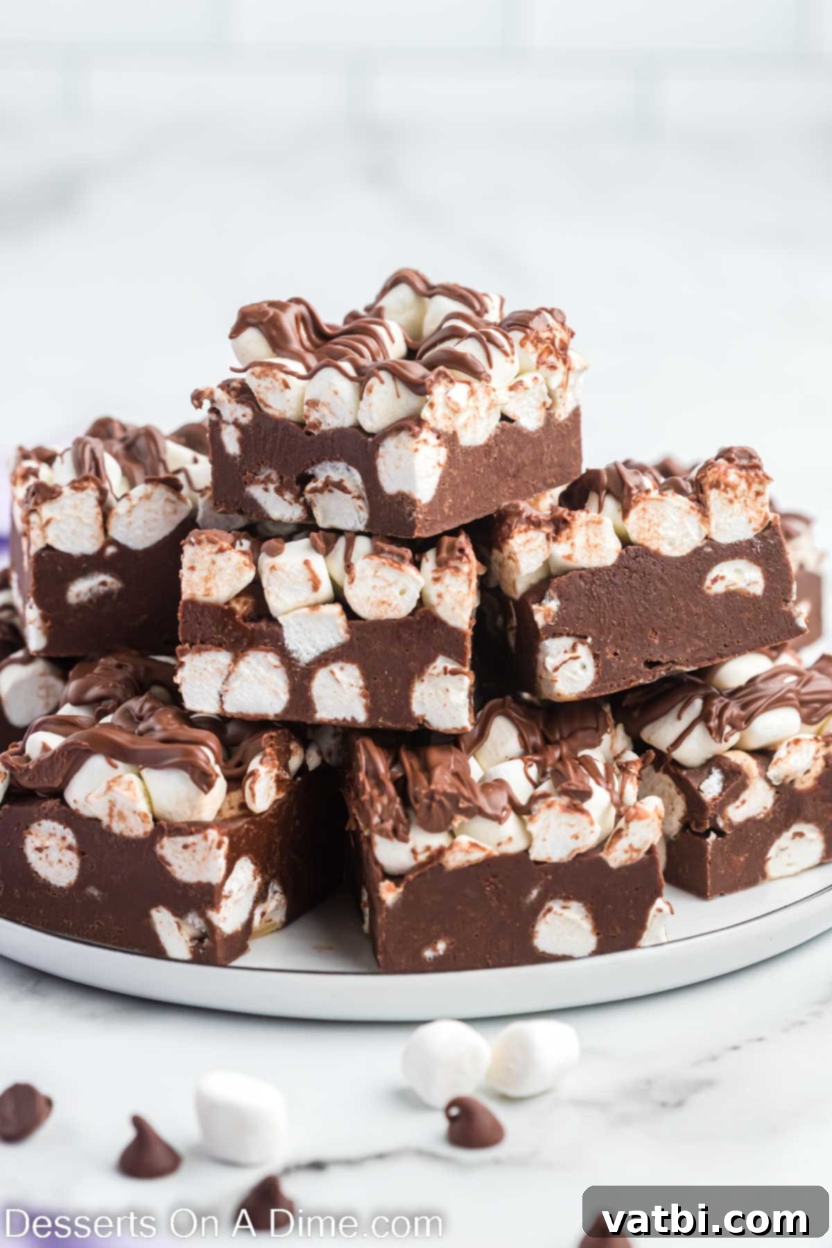 Decadent Hot Chocolate Fudge 12 Hot chocolate fudge cut into squares on a plate.