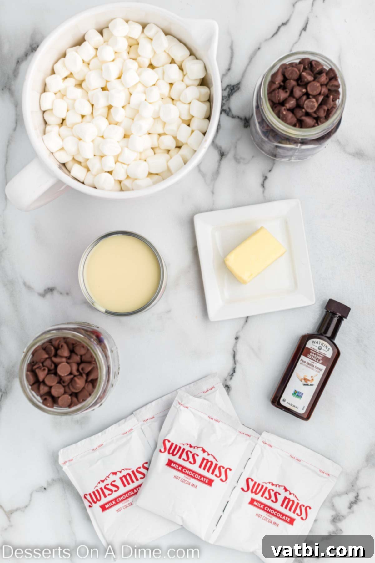 Decadent Hot Chocolate Fudge 3 Ingredients for Hot chocolate fudge - semi-sweet chocolate chips, milk chocolate chips, butter, sweetened condensed milk, hot cocoa mix, vanilla, mini marshmallows,.