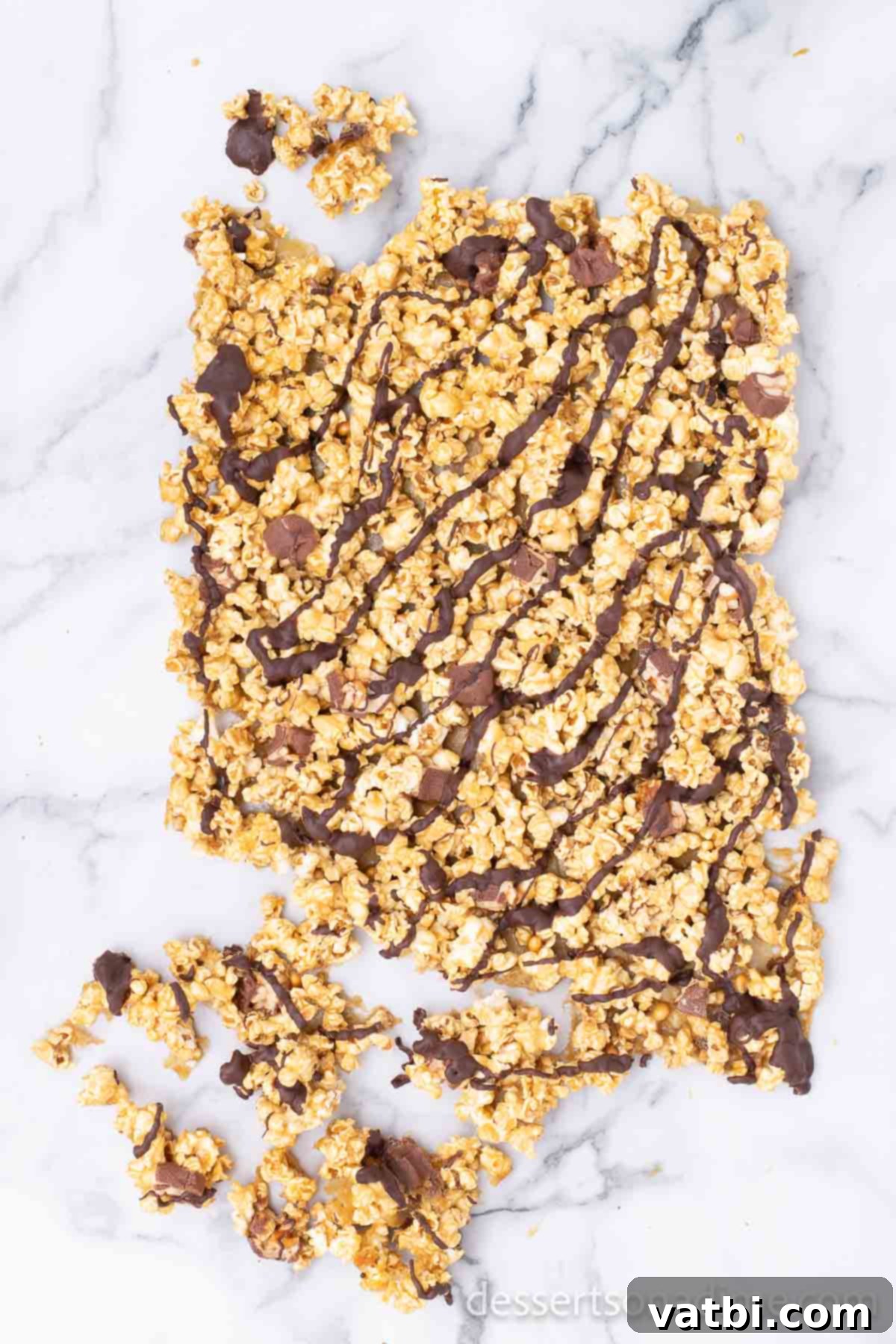 Snickers Popcorn Crunch 9 Finished Snickers popcorn broken into individual, bite-sized pieces, ready for serving.