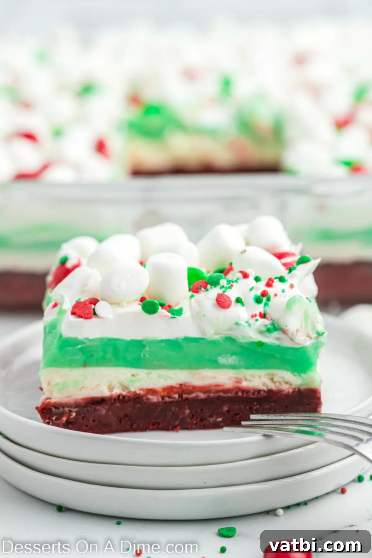 Festive Layered Indulgence 2 Christmas lasagna sliced on a plate, showcasing its vibrant layers.