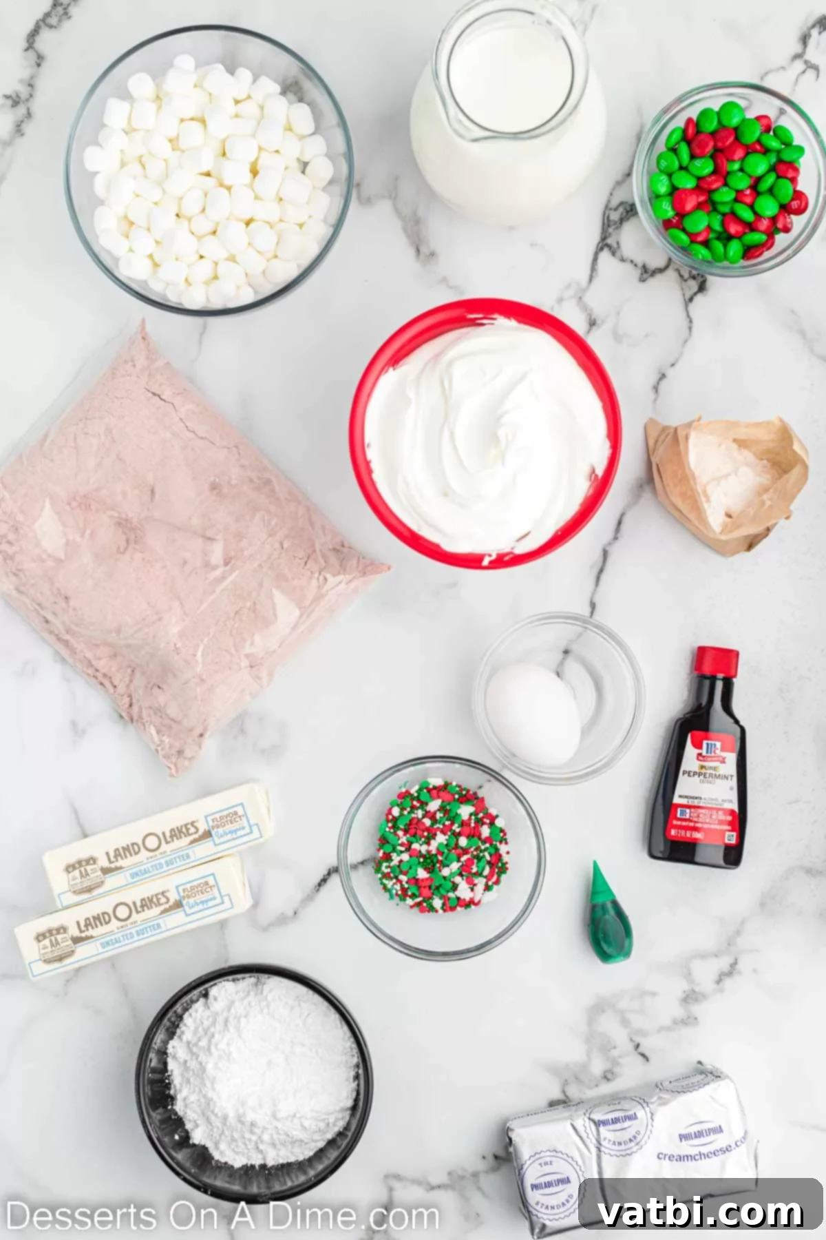 Festive Layered Indulgence 3 Ingredients for Christmas lasagna- cake mix, marshmallows, candy, cream cheese layer, vanilla, butter.