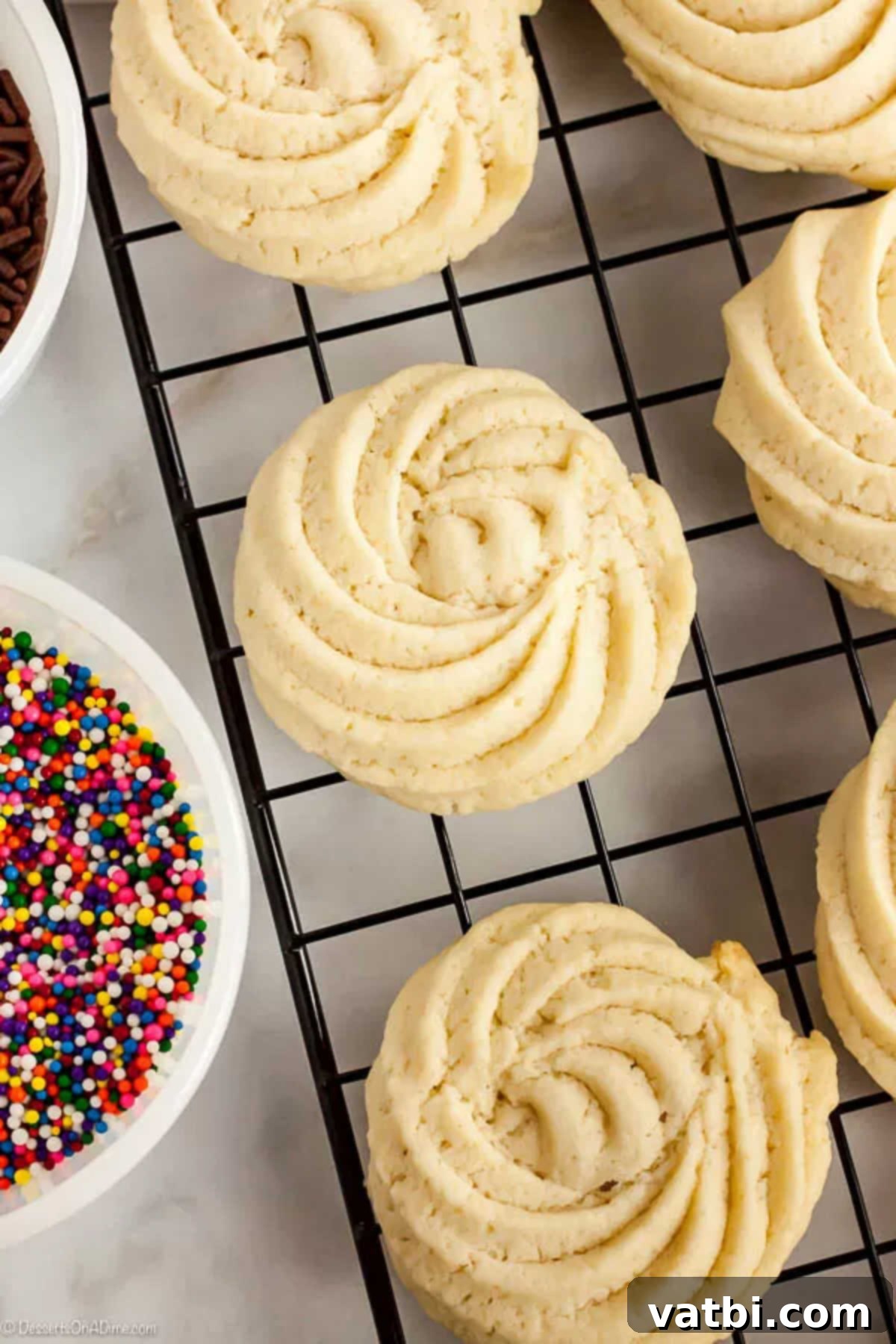 With just a few ingredients, Butter Cookies Recipe comes together quickly for a tasty and gorgeous treat. Easy butter cookies are so pretty and delicious. Butter cookies cooling on a wire rack.