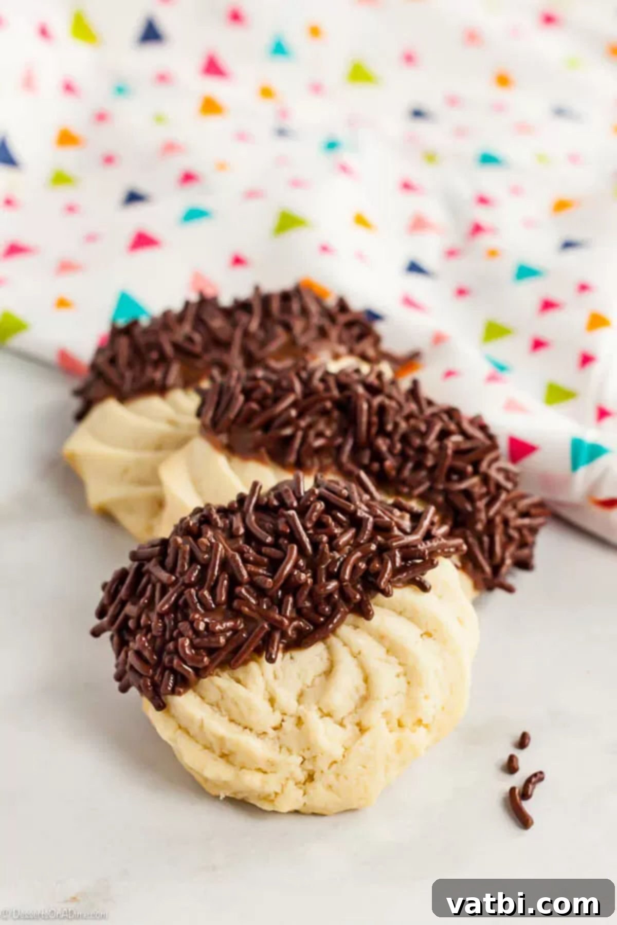With just a few ingredients, Butter Cookies Recipe comes together quickly for a tasty and gorgeous treat. Easy butter cookies are so pretty and delicious. Butter cookies dipped in chocolate frosting and topped with chocolate sprinkles.