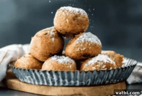 Golden Fried Delights 4 Delicious Deep Fried Brownie Bites, golden brown and sprinkled with powdered sugar, a perfect way to repurpose and elevate brownies.