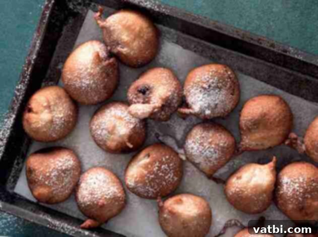 Golden Fried Delights 7 Decadent Deep-Fried Chocolate Truffles, with a rich chocolate interior and a perfectly crispy exterior, dusted with powdered sugar, showcasing their indulgent nature.