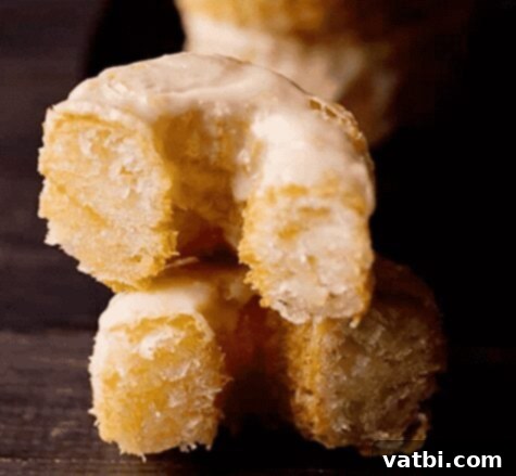 Golden Fried Delights 10 Fluffy and flaky Homemade Cronuts, generously coated with a sweet glaze, offering a delightful combination of croissant and donut.