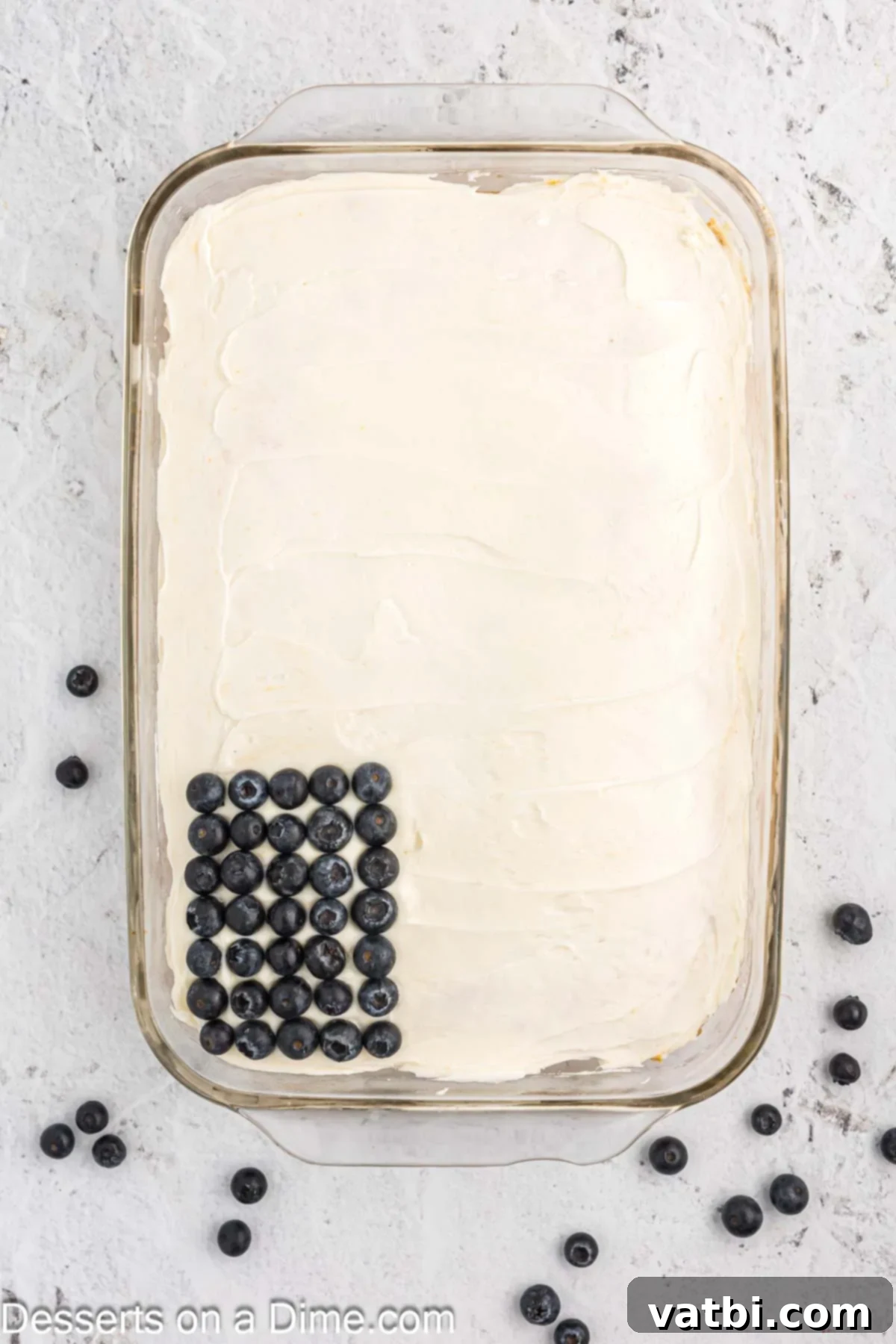 Stars and Stripes Dessert 7 Cake decorated with a blueberry rectangle for the 'stars' and initial strawberry stripes.