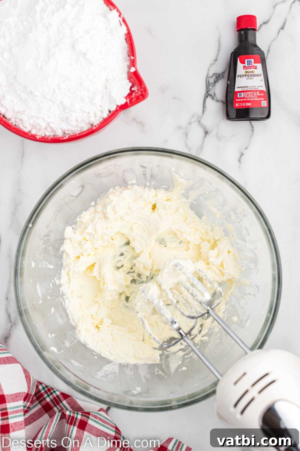 Holiday Mint Magic 4 Cream cheese and butter combined in a mixing bowl until smooth and creamy.